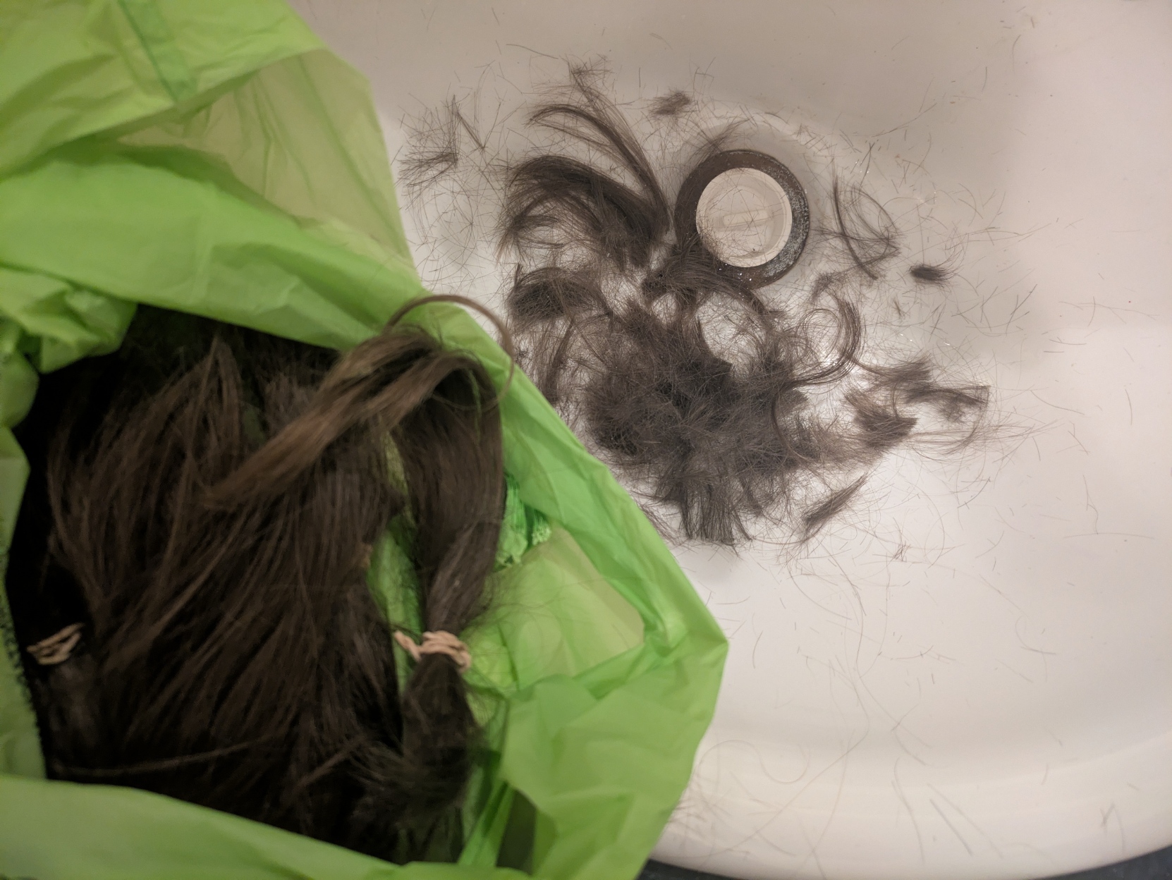 A bag and sink full of human hair.